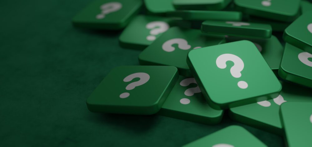 Green question mark on a background of white signs Concept of Asking Seeking for Knowledge