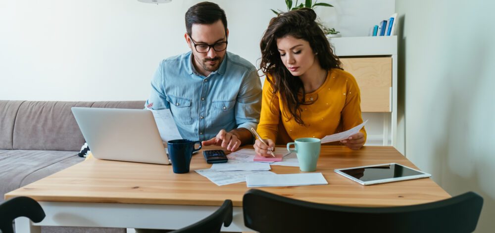 Serious Couple Paying Bills at Home