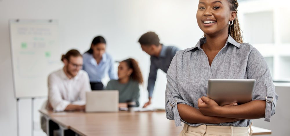 Smile, boardroom and portrait of a black woman with a tablet for training, meeting or teamwork. Happy, business and a corporate employee with technology in a work office for company planning.