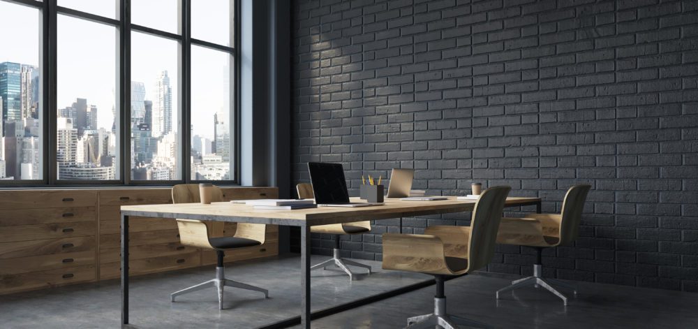 Conference room interior with black brick walls, a concrete floor, large windows and a long wooden table with wooden chairs near it. Side view. 3d rendering mock up