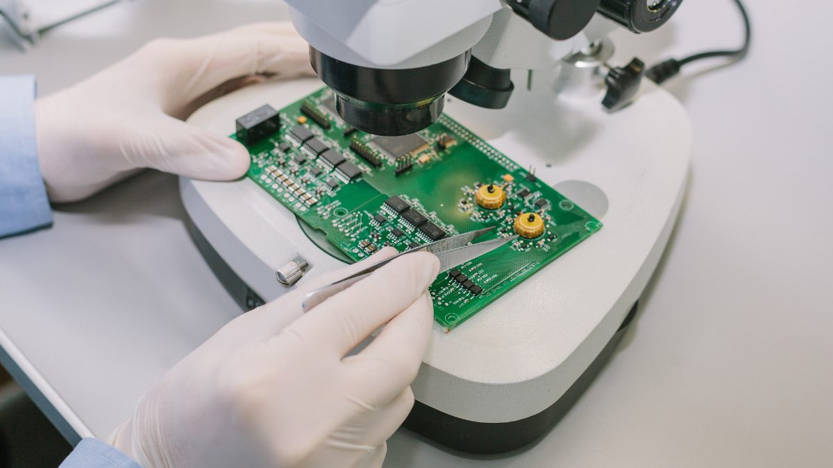QC employee inspecting semiconductor chips